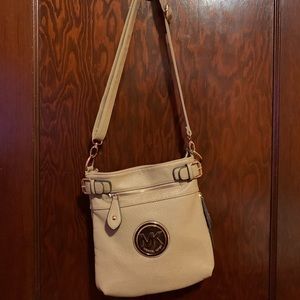 MK light tan leather crossbody.